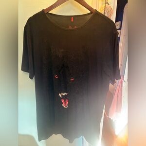 Black T-Shirt with Fierce Wolf Design by Ay Guey. It’s black on black design.